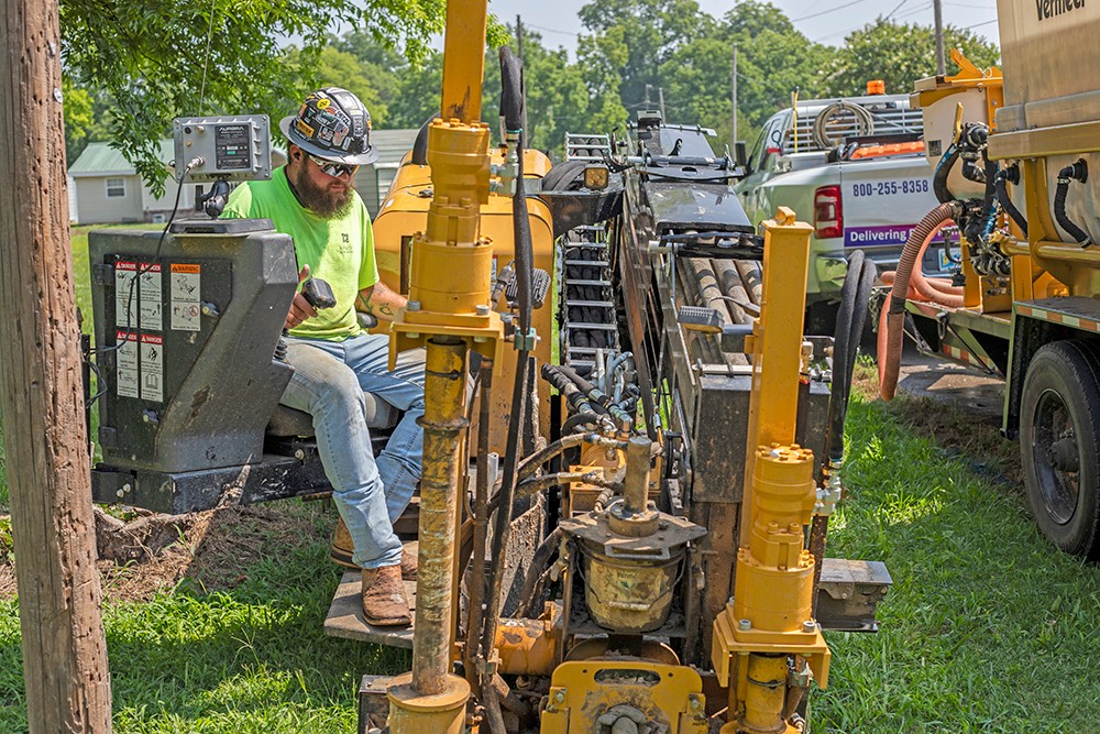 A Kinetic worker uses a horizontal directional drill in Swifton. The drill opens the ground, inserts broadband fiber and runs it horizontally for 300-400 feet before bringing it up again to connect to the customer. A Kinetic worker uses a horizontal directional drill in Swifton. The drill opens the ground, inserts broadband fiber and runs it horizontally for 300-400 feet before bringing it up again to connect to the customer.